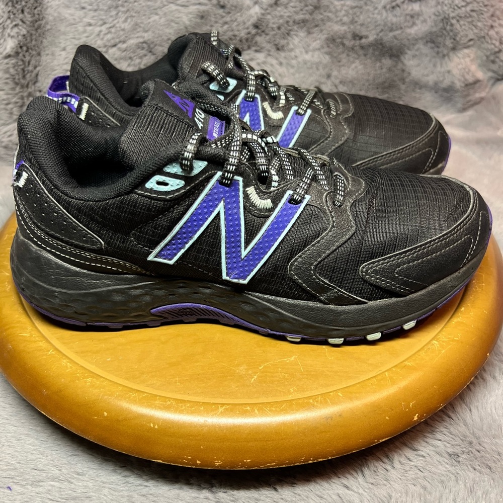 Women’s size 9 New Balance 410’s black and Purple
